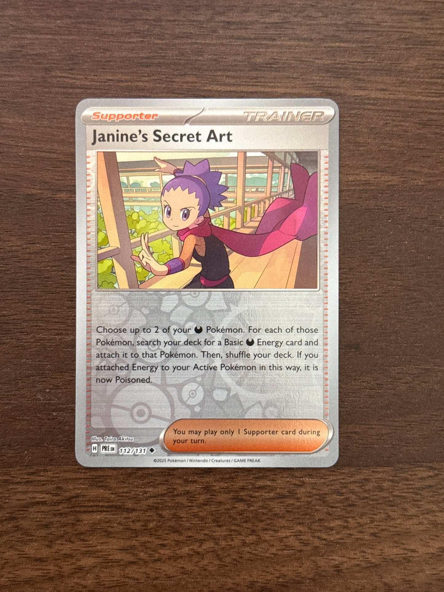 112/131 | Janine’s Secret Art Rev Holo | Prismatic Evolutions