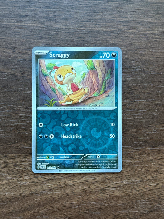 060/091 | Scraggy Rev Holo | Paldean Fates